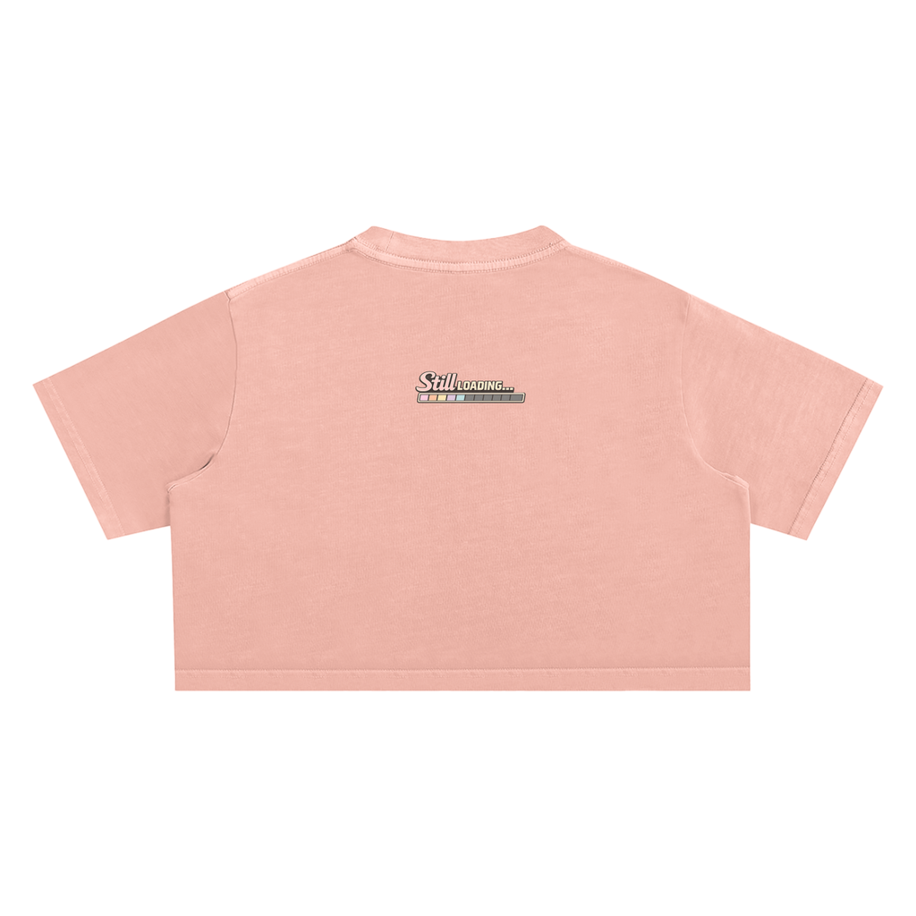 Pink crop top with a brand logo on the back against a white background