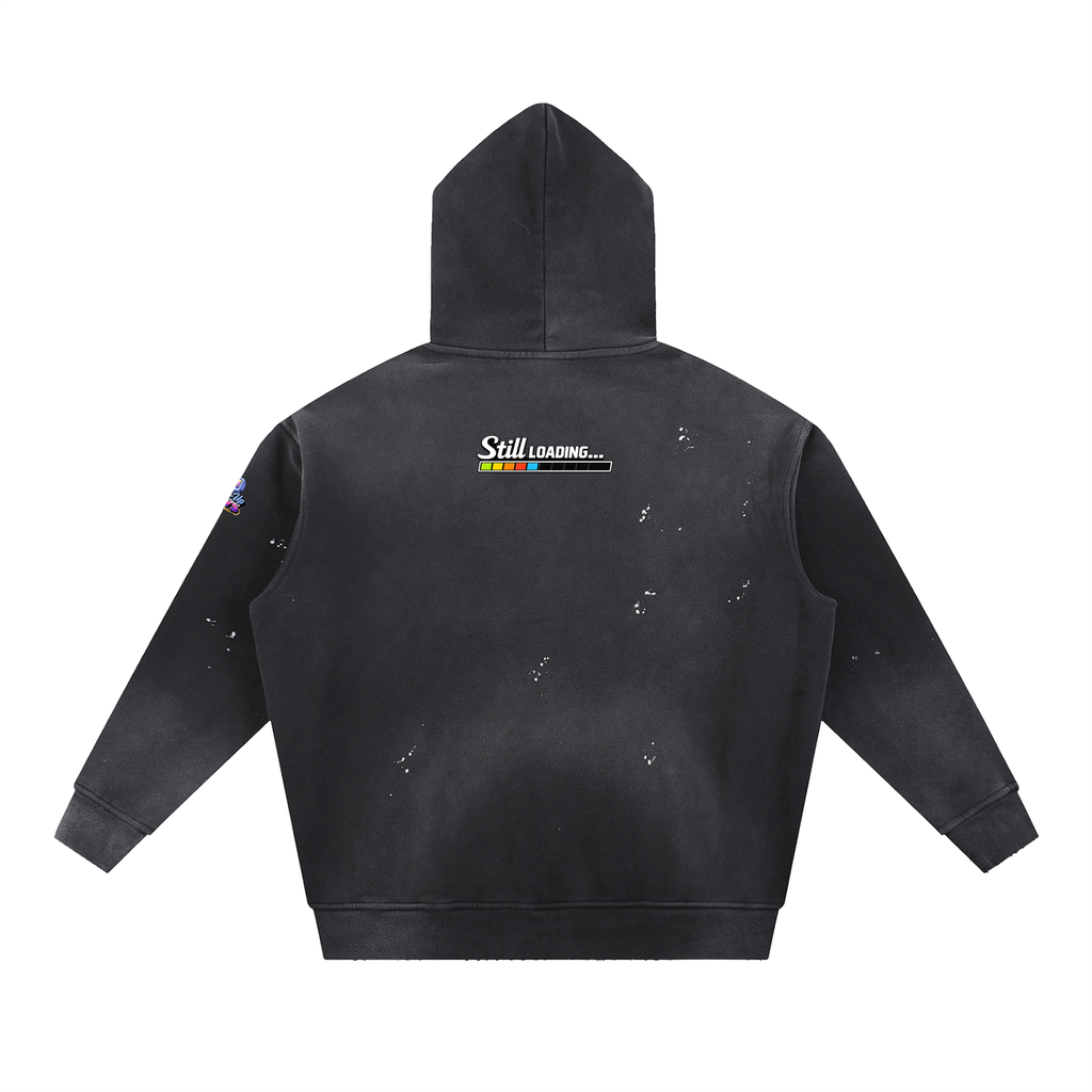 Black hoodie with 'Still Loading' graphic on the back against a white background