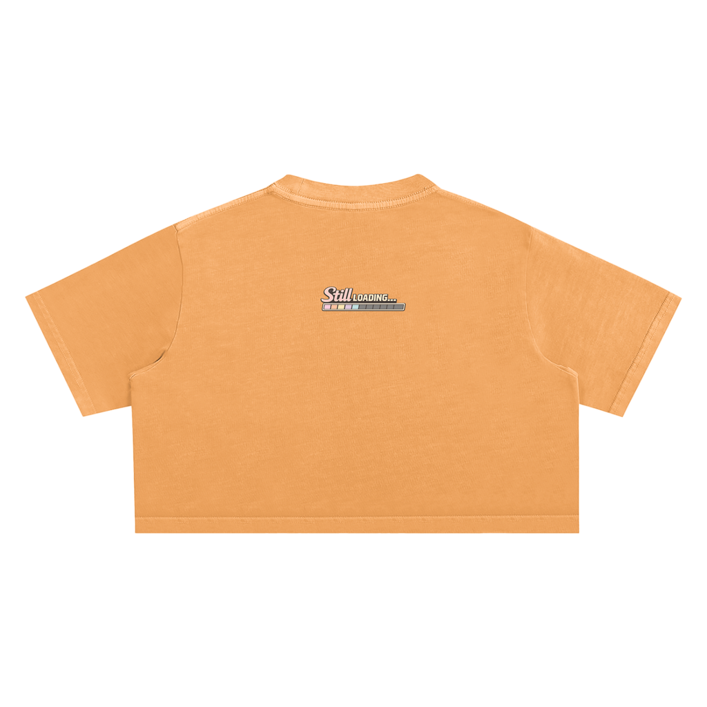 Orange crop top with a logo on the back against a white background