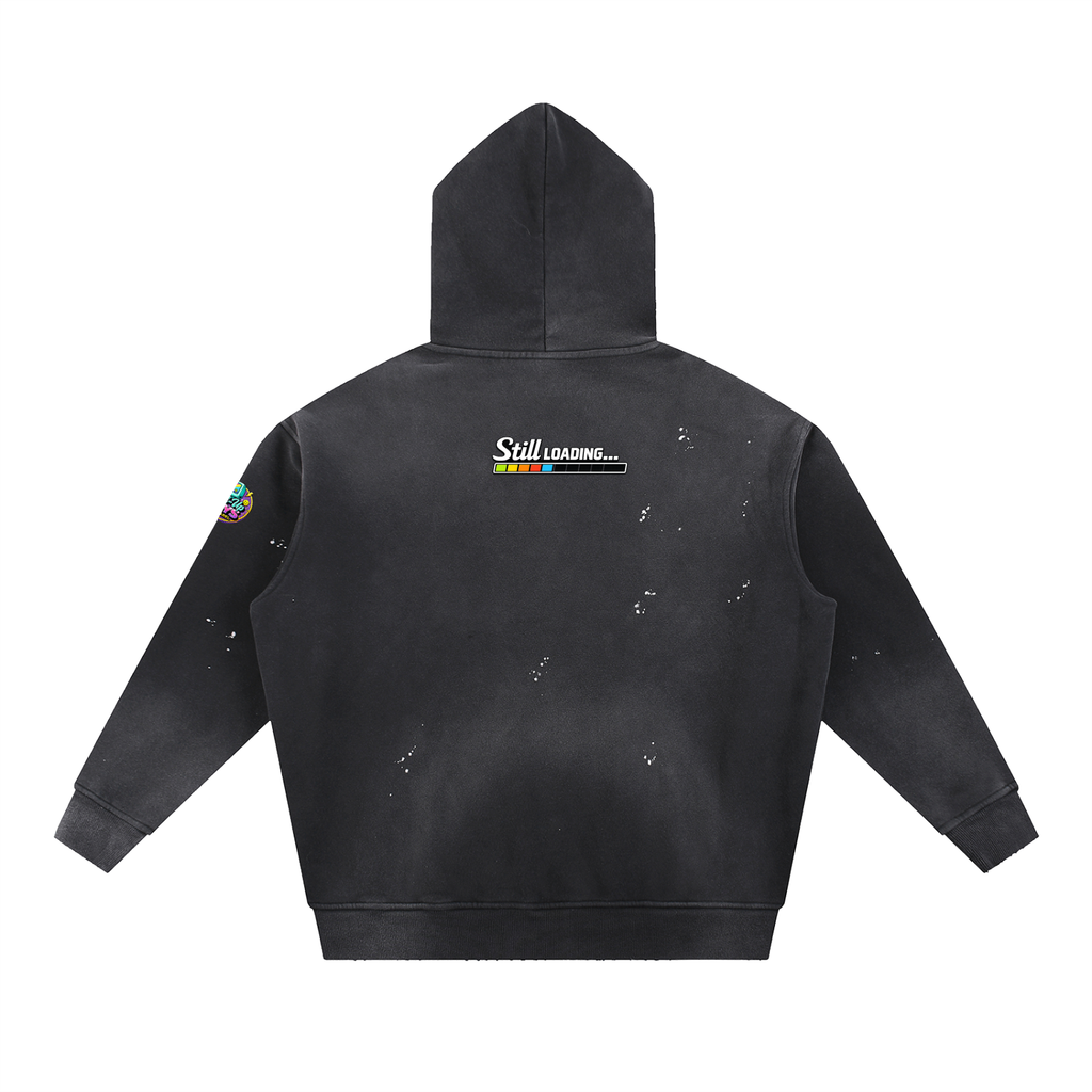 Black hoodie with 'Still Loading' graphic on the back against a white background
